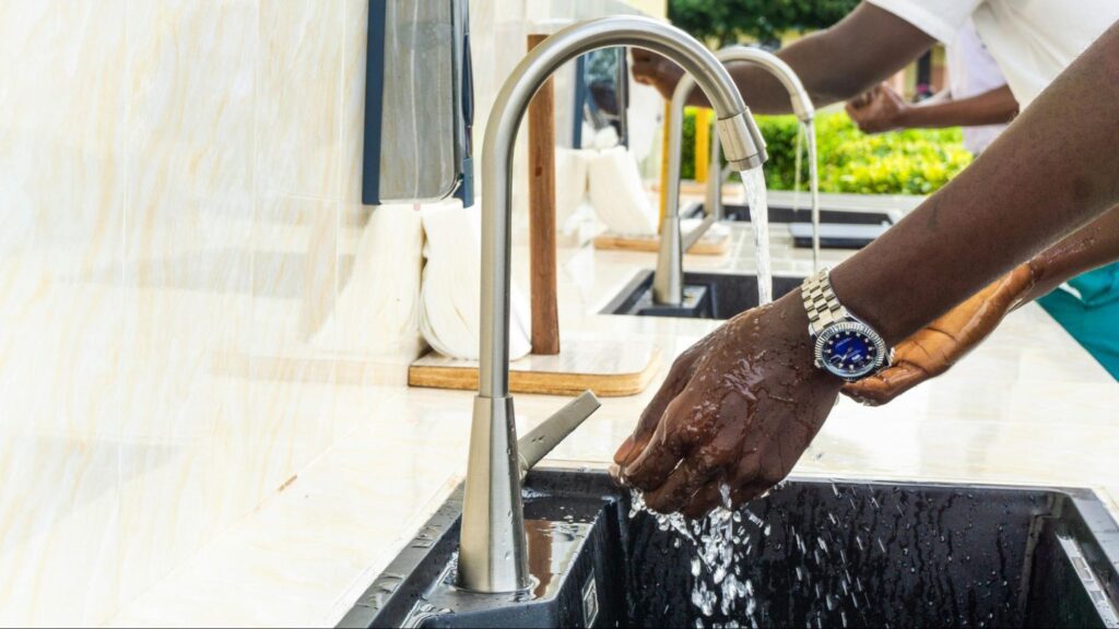 people washing their hands in sinks with newly installed plumbing fixtures