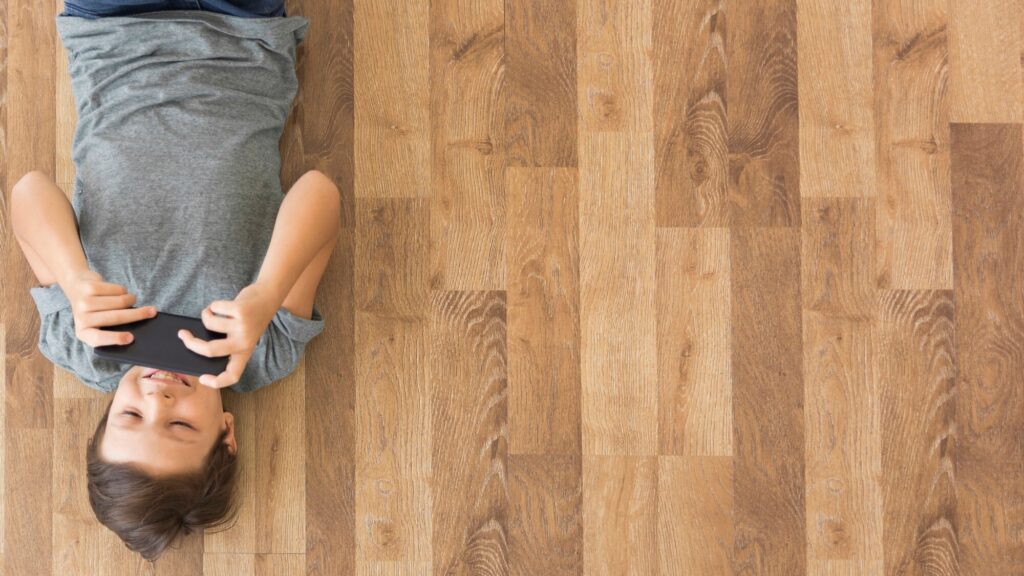 Your Complete Guide to Laminate Flooring 4 kid laying over a stain resistant laminated floor