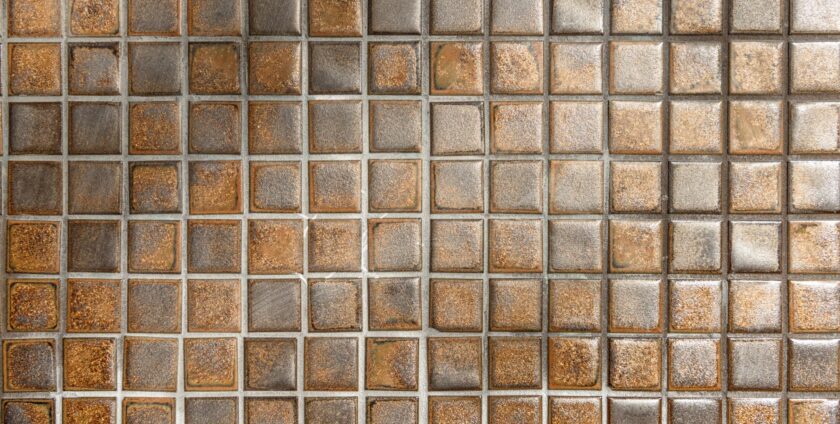 golden coloured tiles installed on a floor