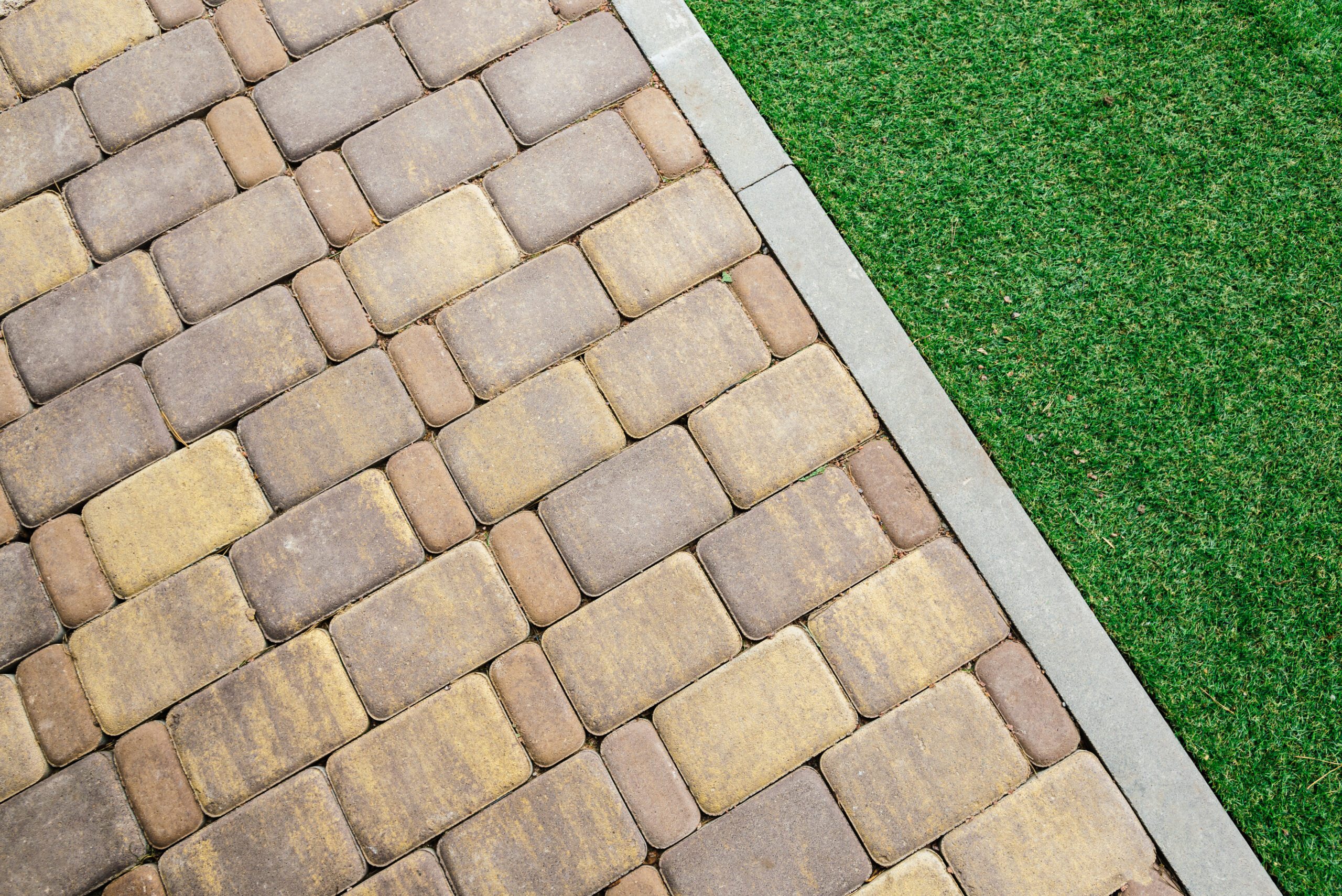 Block Paving And Patio 2 green grass and brick background 2024 02 13 18 29 31 utc scaled Block Paving And Patio