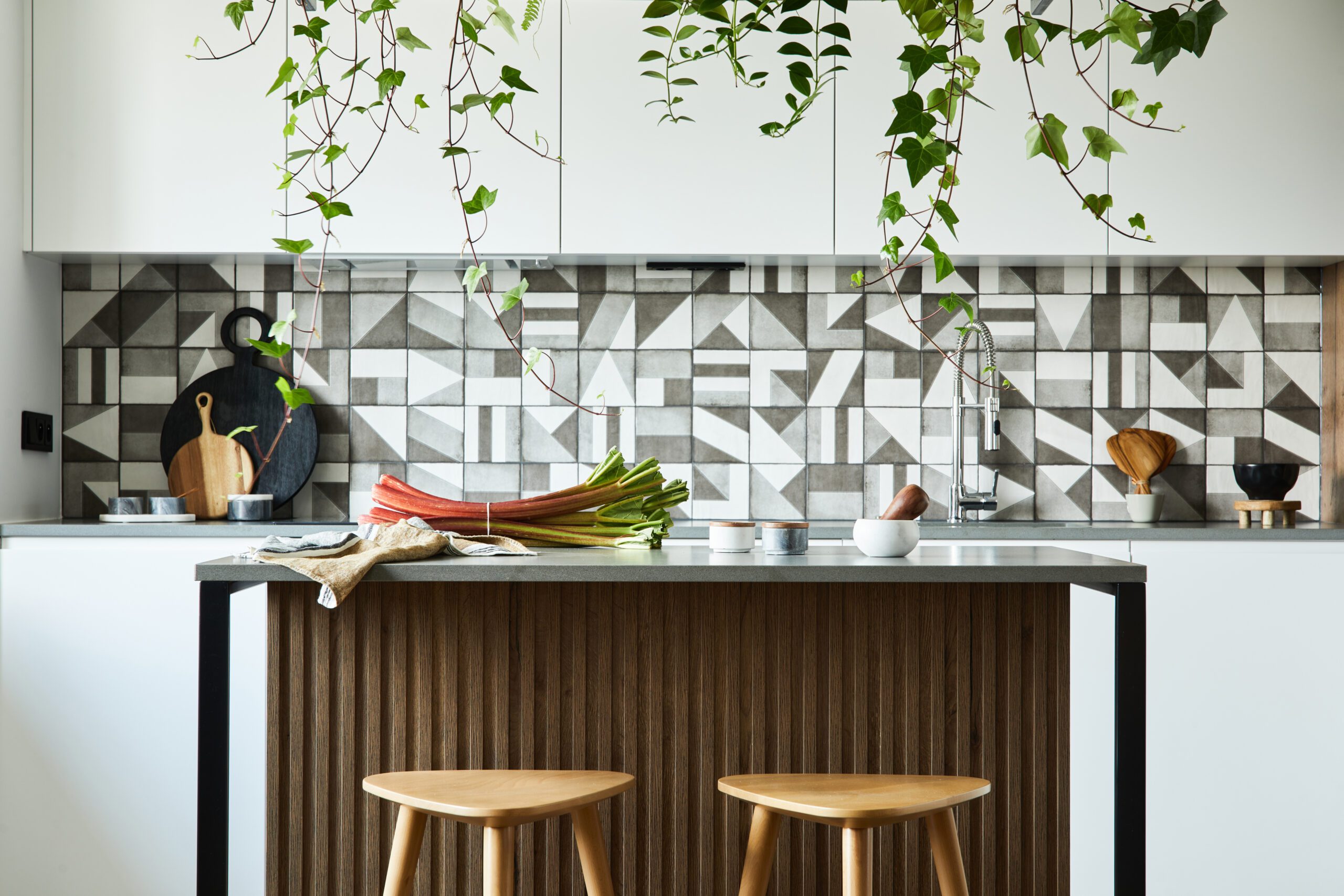 Kitchen Splashback Cork 7 Stylish kitchen interior design with dining space. Workspace with kitchen accessories on the back ground. Creative walls. Minimalistic style an plant love concept.
