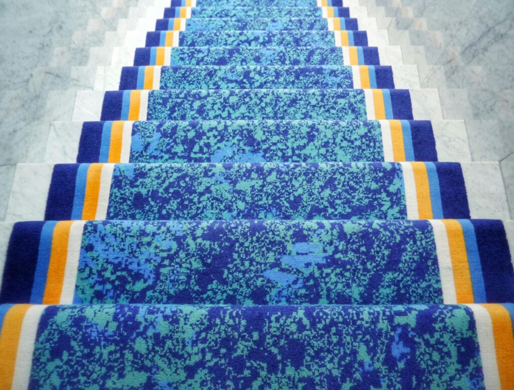 10 Stylish Stair Carpet Ideas 7 A blue staircase rug with stripes in both ends