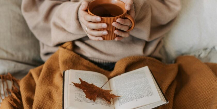 10 Simple and Effective Under Stairs Storage Ideas 1 A woman reading a book and drinking tea
