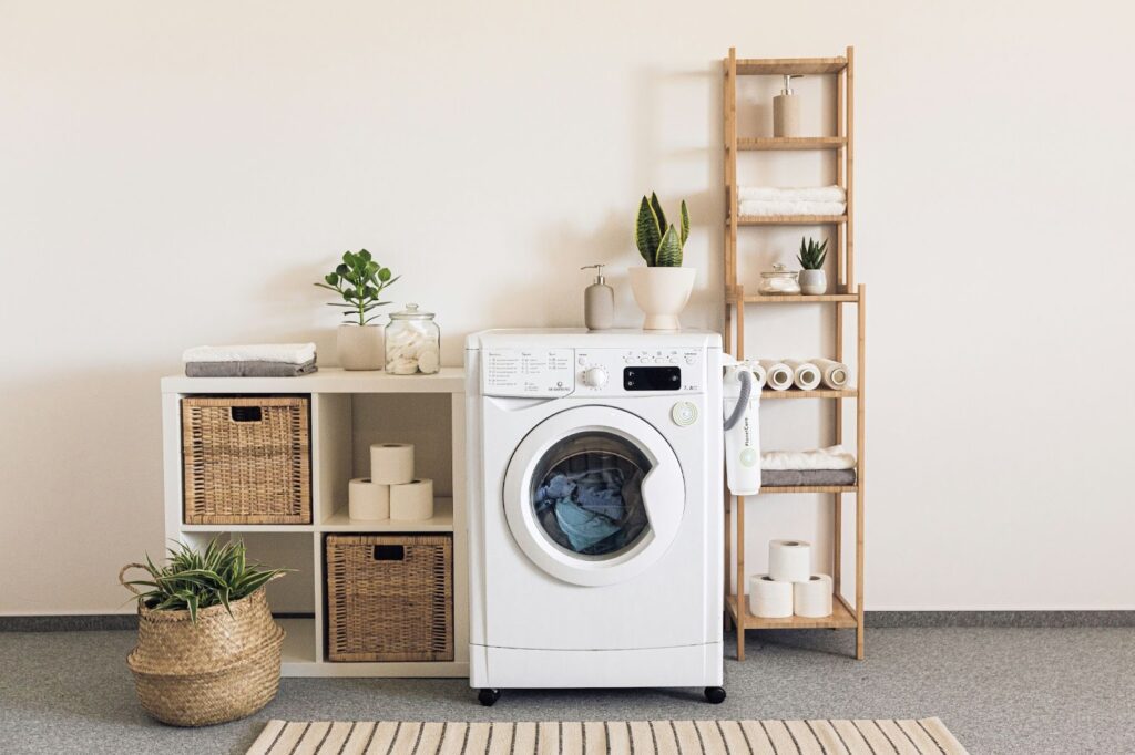 How to Plumb a Washing Machine 2 A washing machine surrounded with shelves with home supplies
