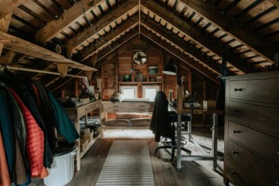 image2 Attic office space with old clothes and a table visible