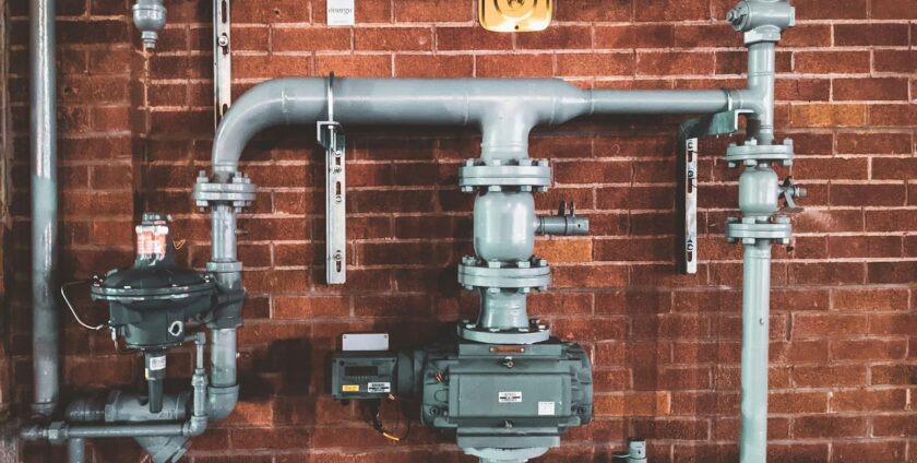 Pipe system on a red brick wall