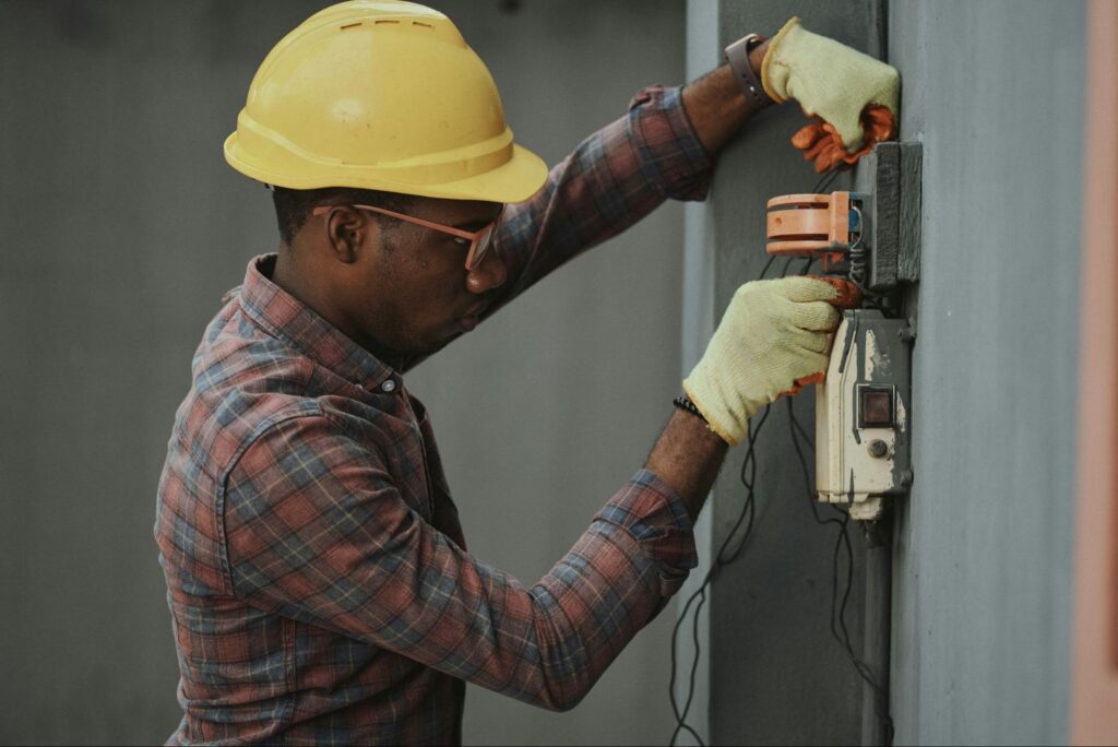 What Is Electrical Installation Work: The Basics 6 Electrician working on an electrical board
