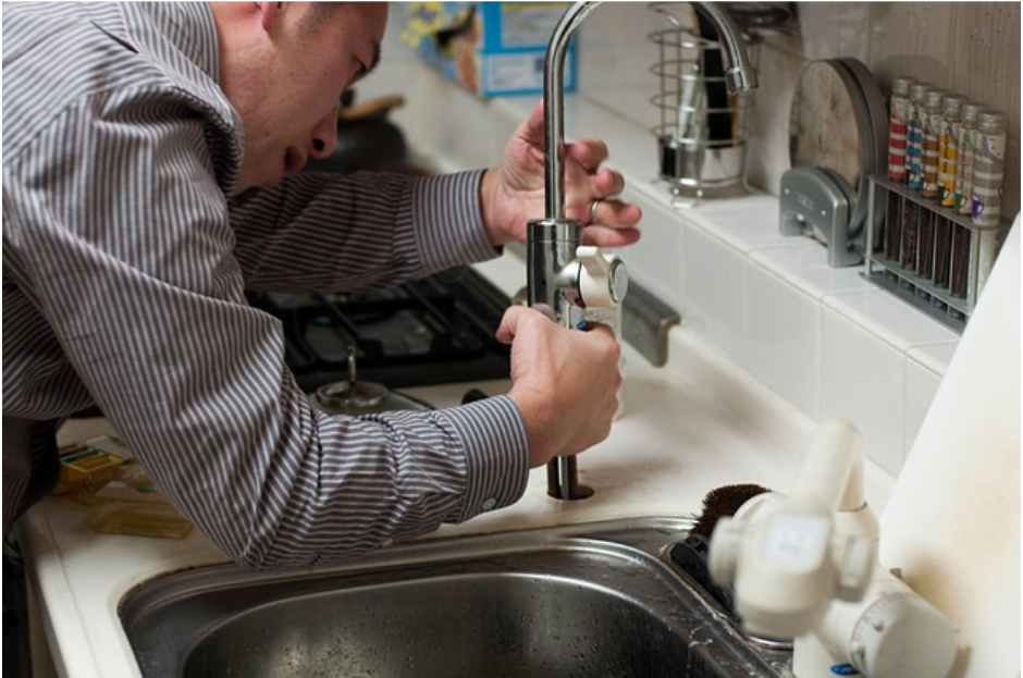 Common Plumbing Problems in Older Irish Houses 3 man fixing a sink